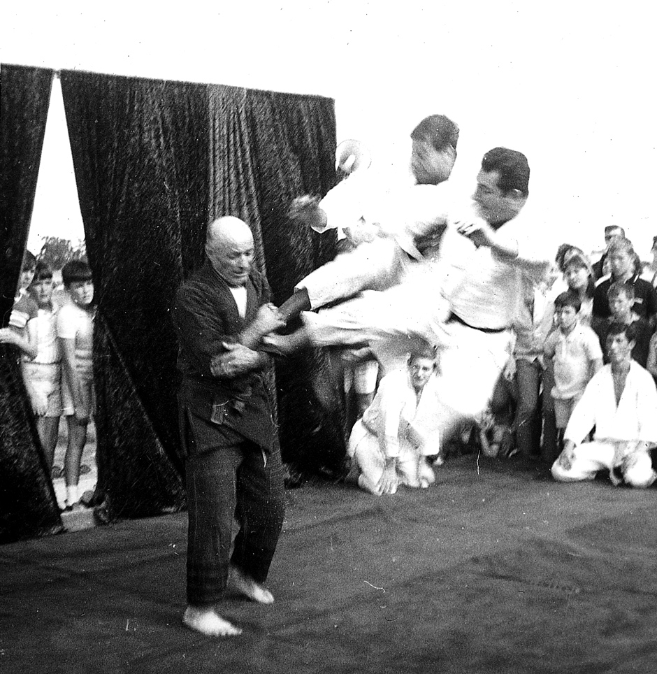 A young Barry Bradshaw performing a flying kick from Shotokan Karate on Professor Strauss during a public demonstration